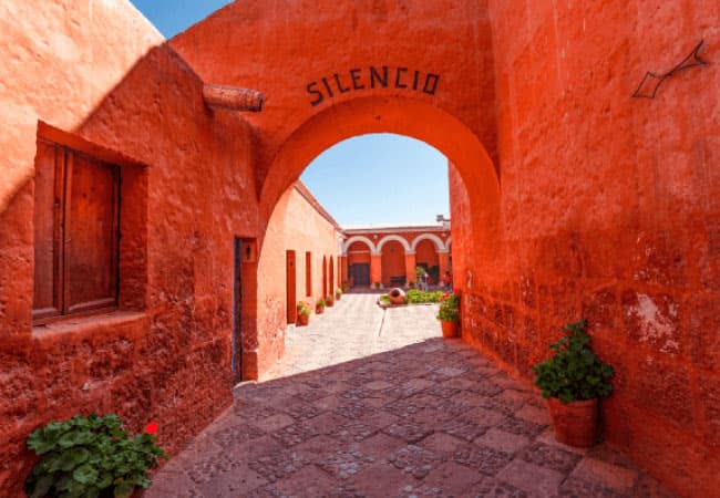 Red walls and arch of Santa Catalina monastery, Arequipa